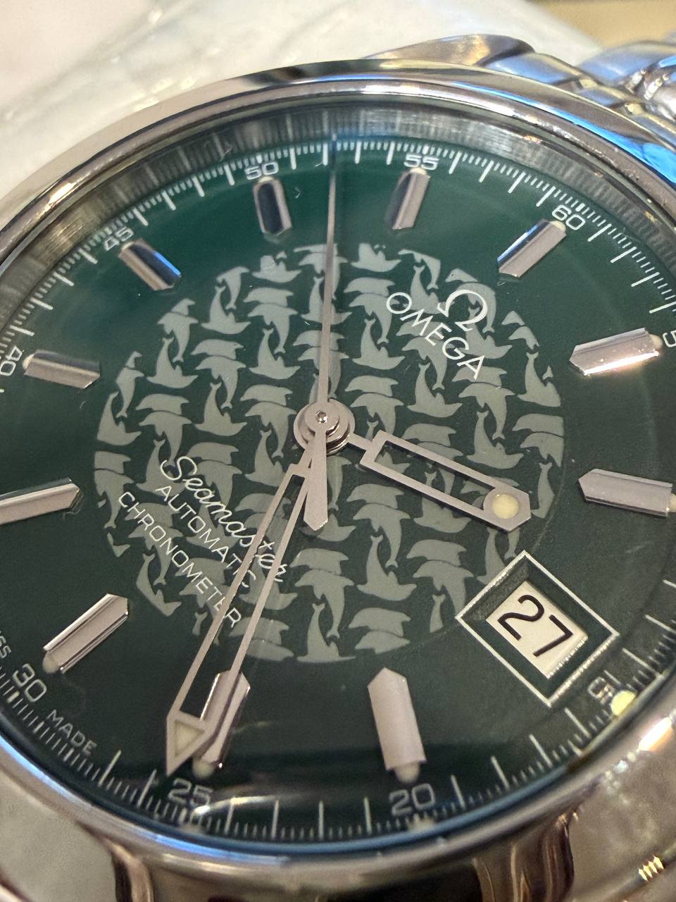 Omega Seamaster Jacques Mayol green dolphin-pattern dial close-up